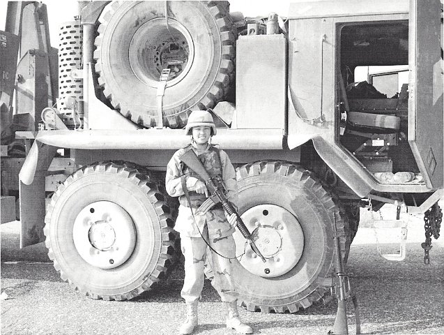 My Daughter in-law in Iraq next to her Convoy Truck v1-1